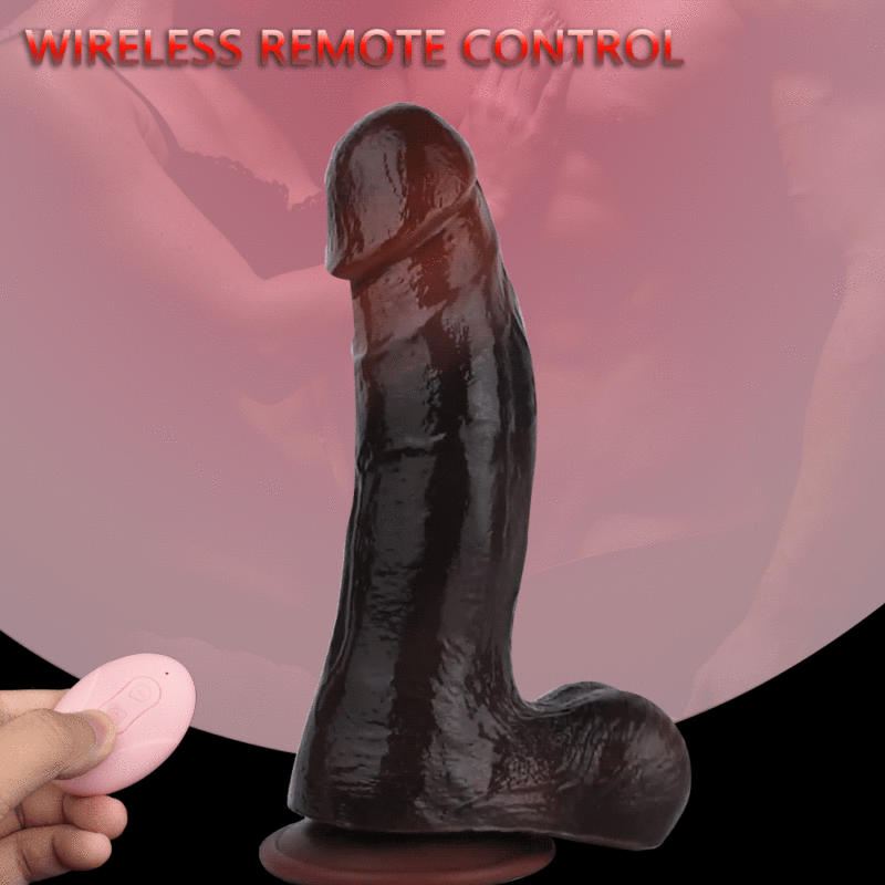Ebony Vibrating Thrusting Dildo with a pink wireless remote held in a hand, against a pink background reading 'WIRELESS REMOTE CONTROL' at the top.