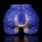 Close-up of a blue dental model showing the upper jaw and teeth, glossy texture against a black background