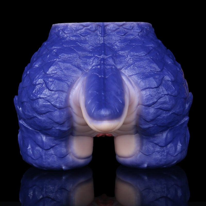 Close-up of a blue dental model showing the upper jaw and teeth, glossy texture against a black background