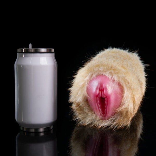 White can beside a Furry Fleshlight prop on a black reflective surface.
