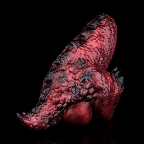 Macro shot of dragon pussy with dark creases, set against a black background, resembling an abstract organic form