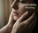 A pair of hands cradling a woman’s face, with tears streaming down her cheeks; the text reads: Dacryphilia Meaning